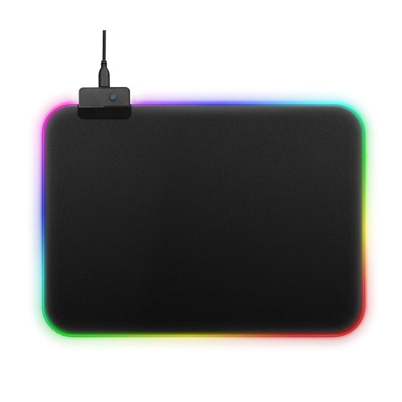 Black mouse pad with colorful LED lighting on a white background. Gaming Mouse Pad