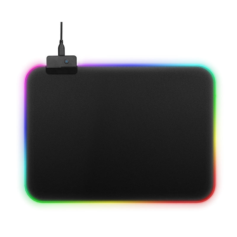 Black mouse pad with RGB lighting on a white background. Gaming Mouse Pad