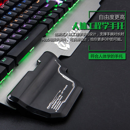 Gaming keyboard with wrist rest and text on a dark surface