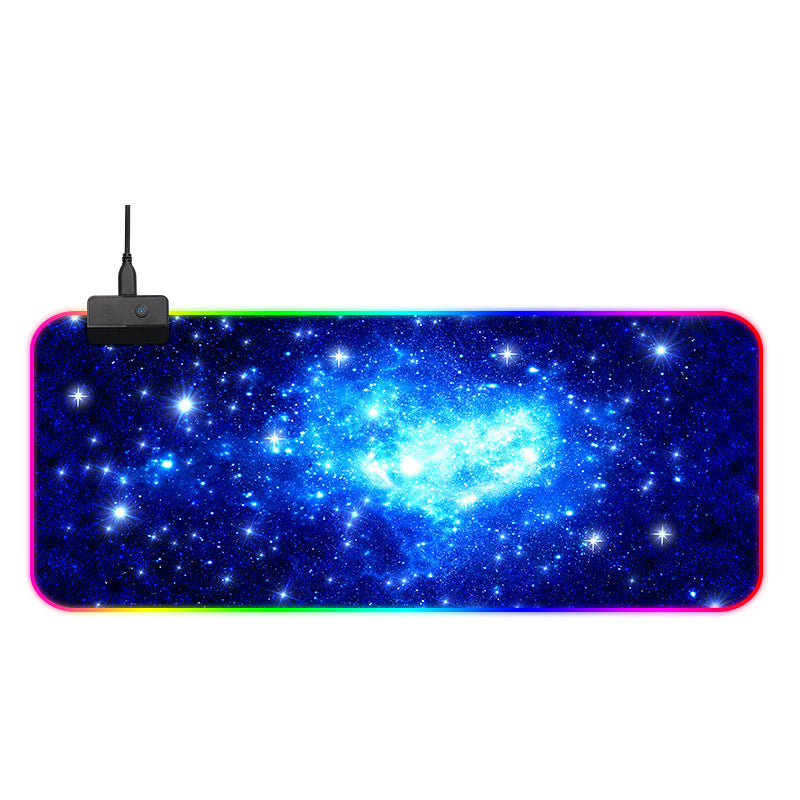 Large mouse pad with galaxy design and RGB lighting on a white background. Gaming Mouse Pad