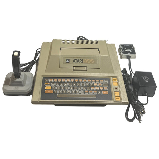 Vintage Atari 400 computer with accessories on a white background