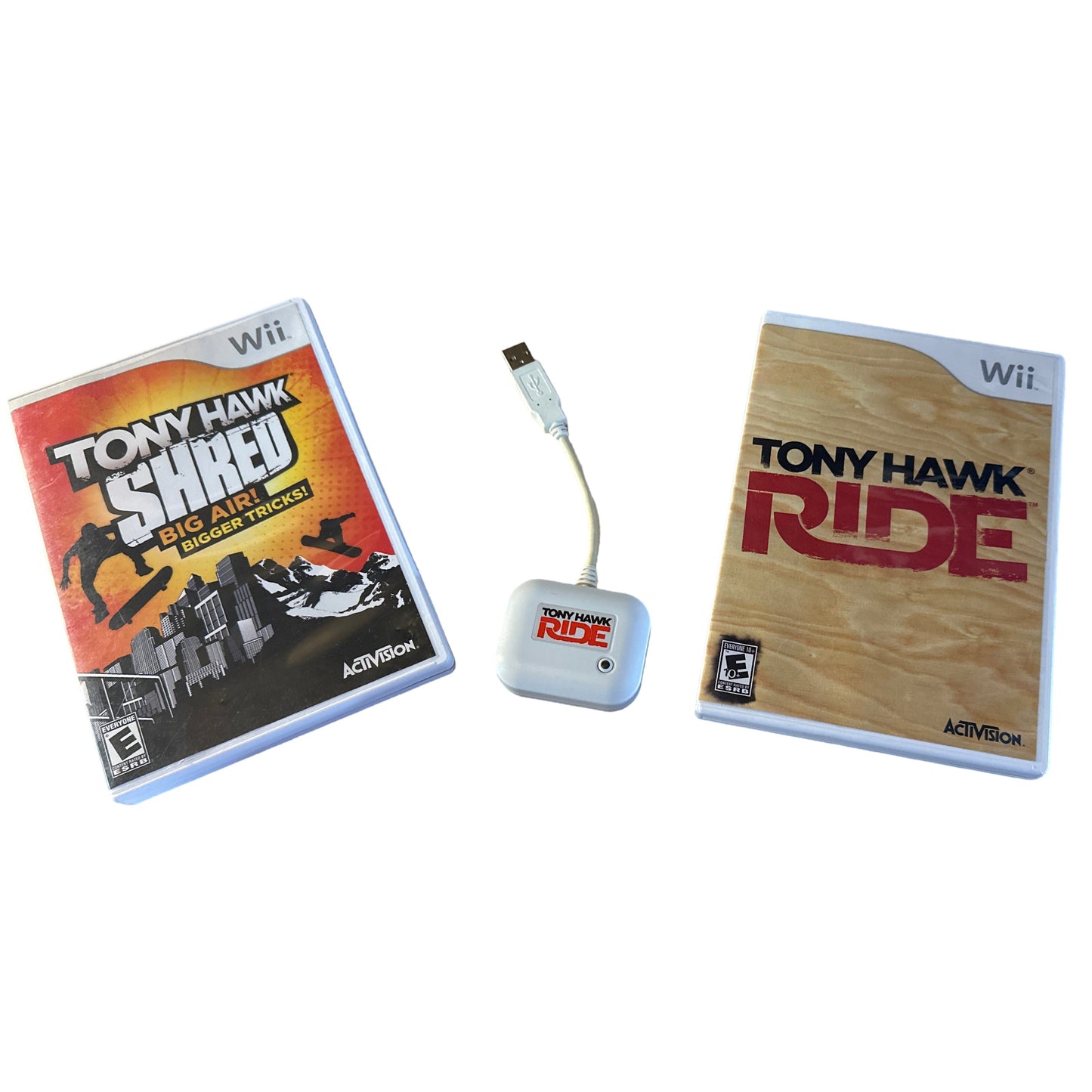Two 'Tony Hawk' games for Wii console with a controller on a white background